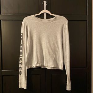 Hollister sweater size xs in gray, with black writing on the sleeves (hollister)